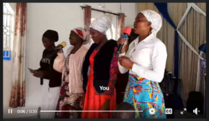A blessed moment as Mrs. Gatia and the Ngaruiya family praise Elohim.